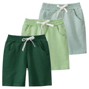 Shorts 2024 Summer New Solid Color Sports Shorts Suitable for Childrens Clothing Elastic Waist Shorts Cotton Childrens Clothing d240516