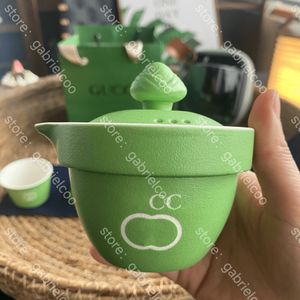 Designer green travel tea set Zongzi shape classic logo carving portable ceramic tea set lazy person one pot three cups outdoor camping tea cup with storage box