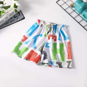 Shorts Summer boys clothing childrens and girls letter printed loose shorts childrens casual cotton bottomed sports jogging beach clothes d240516