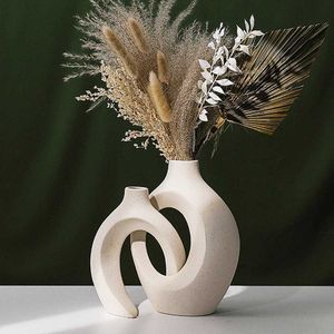 Vasos vaso decorativo de cerâmica branca vaso oco circular vaso de donut vaso de flores usado para acessórios de decoração de mesa interno em salas de estar familiares j240515
