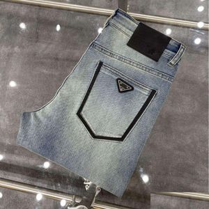 Jeans jeans pantaloni designer maschile di alta qualità uomini slim piccoli pantaloni di denim in cotone dritti di cotone figurano lettere logo triangolo ottv9