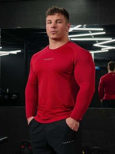 Trendig fitnesssport långärmad t-shirt herrar smal fit andningsbar fritid elastisk träning topp höst och vinter ny stil