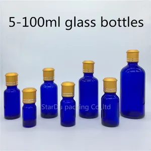 Lagringsflaskor 5 ml 10 ml 15 ml 20 ml 30 ml 50 ml 100 ml blå glasflaskflaskor eterisk olja med dekorativt mönsterlock