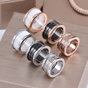 Luxur Designer Ceramics Spring Ring Silver Rose Gold Ring for Lovers Titanium Steel White Black Ceramic Par Ring for Women Men smycken gåva