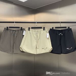 Summer masculino shorts famosos calças de marca famosa de alta qualidade letra de letra de nylon impresso Casual Casual Cargo solto calças curtas