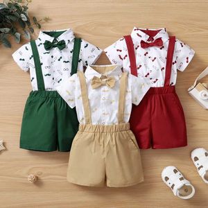 Kläder sätter 2st sommar babykläder set kortärmad tight fit bow+hängande kortärmade festivalparti gentleman kläder 0-24 månader J240518
