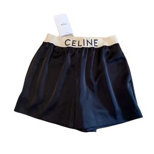 Calça feminina CE24SS Novos shorts de ácido acético versáteis da moda, exibindo pernas, decoração de fita impressa longa por letra.