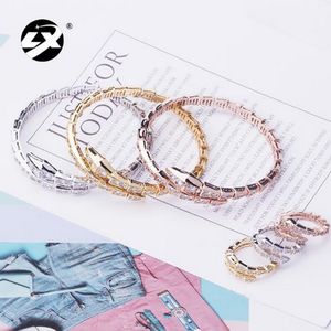 Creative spring snake shaped bracelet ring set with adjustable opening elasticity for women's jewelry wholesale in European and American Designer Jewelry