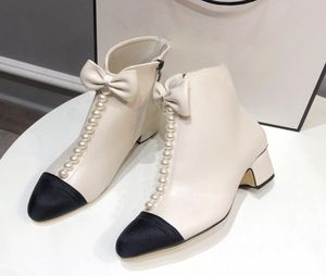 2023 مصممة فاخرة نساء أحذية CNEL CEL CAP TOE ZIPPER LEARLS BOW مزينة في الكاحل الحذاء الأزياء النسائية أحذية الكعب المكتنزة الأسود WHIT7088587