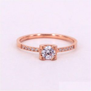 커플 반지 New Fashion CNC Small Diamond Four-Claw Zirconia 로즈 골드 반지 꼬리 테일 인덱스 핑거 드롭 배달 보석 OTJDI