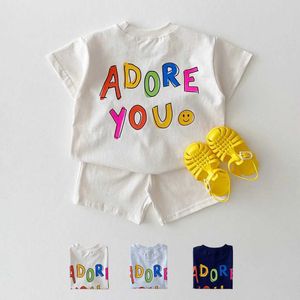 Clothing Sets Korean baby girl clothing set double-sided printed smiling face letter T-shirt loose cotton shorts 2 pieces of baby boy clothing J240518