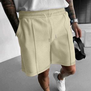 Mäns shorts nya casual mens shorts fast färg veckad borstade raka shorts 2024 Vår/sommar gata män fashionabla shorts q240520