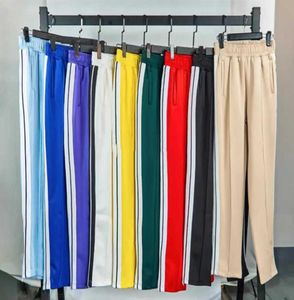 Calças de grife masculino Palms soltas esportes de calça longa com zíper de calça de jogger calças de jogador casual calças de soldados listras laterais esportes esportes9958931