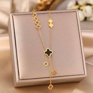 Titanium steel necklace gold four-leaf clover hollow tassel fashion clavicle chain