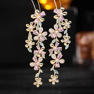 Designerschmuck S925 Silbernadelohrringe für das super unsterbliche Abendkleid von Frauen gepaart mit langen Ohrring der Blumenindustrie