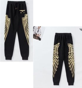 Highquality Men039s Pants highend eagle wings bronzing printing men and women the same style couple trousers B010183431584070523