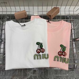 2024Miu Family Cherry Bead Letter Short sleeved Tshirt for Womens SpringSummer New Small Fresh Aging Solid Color Round Neck Tops