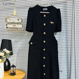 Sukienki dla kobiet sukienki mody metalowy wisiorek czarny bustier swobodny szczupły guziki krótkie rękawy 99c