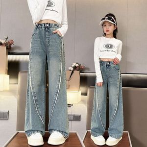 Dżinsy dla dziewcząt dzieci elastyczna talia obdartą krawędź splicing design koreańskie mody dżinsowe spodnie nowe wiosenne nastolatki szerokie spodnie 5-14Y L2405