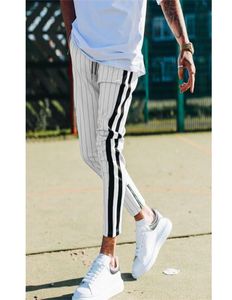 Mody mężczyzn w stylu Anglii Striped Pants Mężczyzna długie ołówki joggery swobodne spodnie do sznurka boczne paski spodni T2007064053824