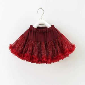 Kjolar flickor 2024 sommar ny solid färg enkel rött tryck prick konvex kjol/halv kjol y240522