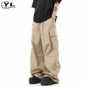 Calças masculinas Retro dobrável calças de carga masculino Hip Hop Versátil calças de bolso múltiplo Spring e Autumn High Street Elastic Troushers Y240522