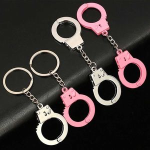 Keychains Lanyards kreatives Armband Form Anhänger Keychain Pink und Silber Schlüsselbeutel Hängende Dekoration Herren Punkschmuck Geschenke Q240521