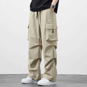 Men's Pants 2024 New Summer Wide Legged Mens Cargo Pants South Korean Street Clothing Casual Pants Solid Fashion Nylon Comfortable Fabric Straight Pants Y240522