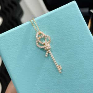 Designer's S925 sterling silver hollowed out knotted key necklace light luxury and high-end feeling new minimalist daily electroplating rose gold