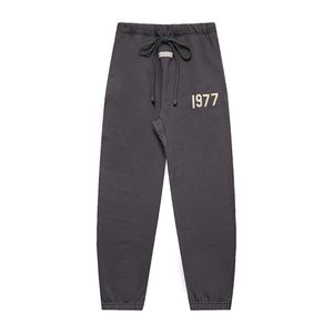Calça de moletom de moletom de moletom 1977 Homens femininos lote cargo preto calças quentes calçadas calças de algodão grossa 100% de alta qualidade
