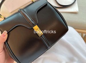 トップデザイナーの女性バッグファッションショルダーラックスゥリリーハンドバッグメタルロッククラムシェルデザイン財布ミニ2024クロスボディバッグ