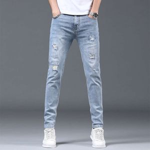 Final de jeans High Jeans Spring e outono Temporada Novo produto Trendy Brand Elastic Slim Fit Perforated Leg para Calças Casuais de Men S