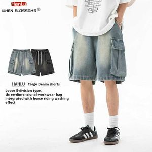 Shorts masculinos de moda coreana masculina shorts de jeans de perna no verão novo cintura elástica casual solta de bolso de bolso de jeans de jeans Q240522