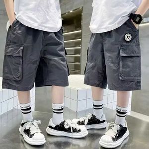 Shorts Shorts 2024 Boys Shorts Summer Childrens Loose Trousers Youth Boys Casual Thin Multi Pocket Cargo Shorts Childrens Cotton Pants 4-14Y WX5.22