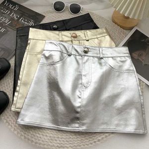 Kjolar kjolar baby girl pu läder kort läder enkel knapp elastisk midjeband anti promenad glänsande barn och tonåringar läder shorts 3-15y wx5.21