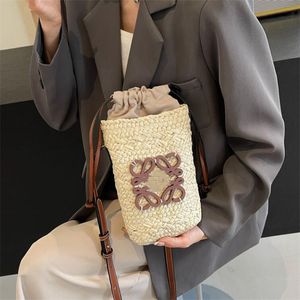 Fashion Luxury Evening bag designer bucket bag leisure straw woven material leisure sports bag can be carried across the body slung bag