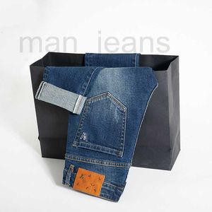 Męski projektant dżinsów jesień i zimowe dżinsy męskie błękit roboczy kolor swobodny wszechstronny haft mała prosta lampka moda marki dżinsy dla mężczyzn mody mężczyźni