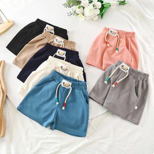 Shorts Boys shorts summer 2023 childrens beach shorts candy color childrens pants girls casual Trousers baby sportswear 1-12T Y240524