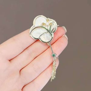Flower gentleman orchid high-end brooch ins women's Chinese fan tassel suit clip ancient style qipao pressed collar