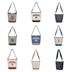 Large letters logo decoration leisure college wind adjustable shoulder strap canvas bucket bag hand bill of lading shoulder crossbody bag regular men and women with