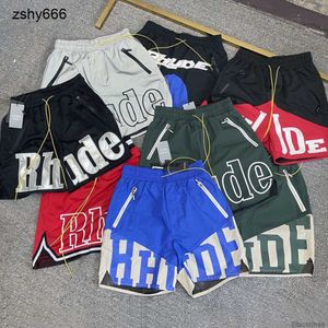 Designers Casual calça calça calça calças de suprimentos de moletom alta versão rhude letra bordada malha cortada shorts arco -íris masculino higiênico 3m anti America