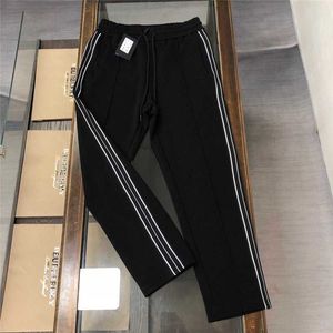 Calça de homens no início do outono P Família Claic Triangle Guard Pujia e mulheres Mesmo estilo Sports Long Sports Casual Feet Pxum