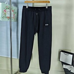 Pantaloni da uomo ad alta versione alla moda in ferro triangolare standard guardia uomo famiglia ordinaria preire striscia di gomma tasca casual pantaloni per gamba veloce quing qoe