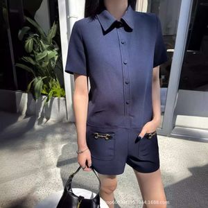 Kvinnors badkläder tidigt på våren moderna fashionabla ridspänne rak stil djupblå jumpsuit shorts