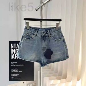 Kvinnors shorts designer märke vår och sommar ny mångsidig mode hög midja tjej stil skarvad triangel ficka denim för kvinnor ucud