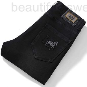 Projektant dżinsów męskich europejski wysokiej klasy czarny bawełniany elastyczne dżinsy, małe stopy męskie, moda koreańska, wszechstronne białe spodnie zce