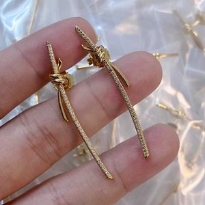 Fashion Gold plating material star same style Knot knotted full diamond long strip earrings T interwoven knot