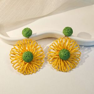 style Bohemian vacation handmade woven Lafite grass with contrasting color hollow flower earrings