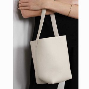 Die Reihenbeutel Eimerbeutel Designer Sommer neue kleine oberste Schicht Litschi Getreide Cowide Tasche Ins Handtasche weiblich 282f