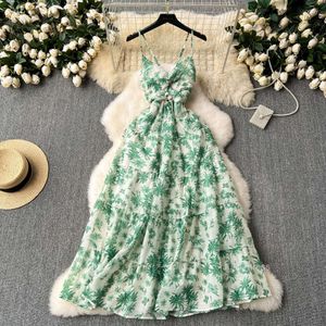 French vacation style dress for womens summer new niche trick hollowed out hanging neck suspender with waistband printed chiffon skirt
